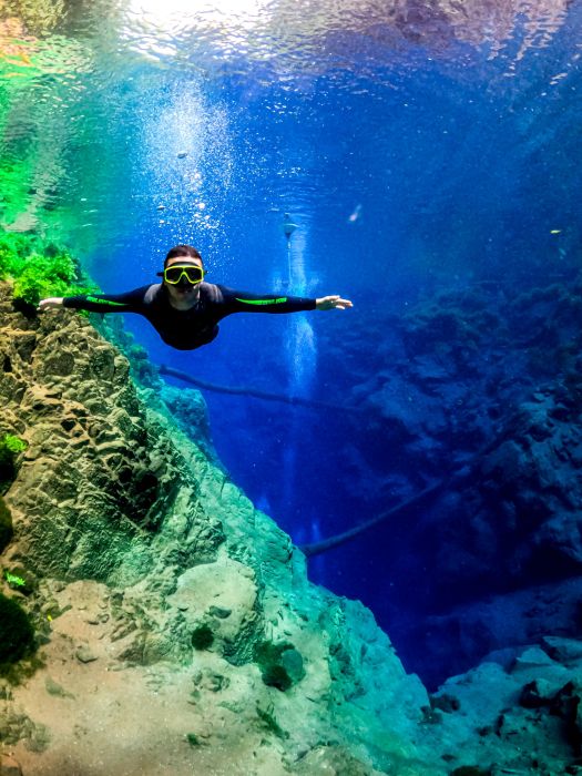 Explore the beauty of the Mysterious Lagoon as you float on its crystal clear waters, immersing yourself in a world of serenity and enchantment.